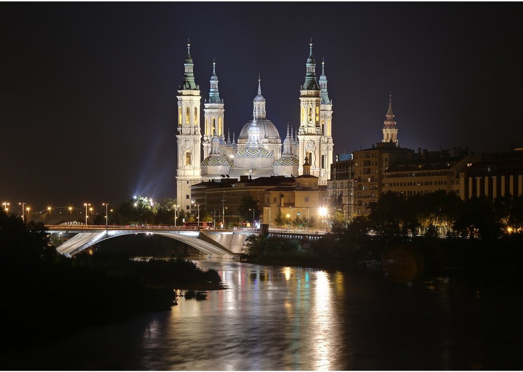 Zaragoza. The Cathedral of the virgin Pilar at night. View from the bridge of Almosara.