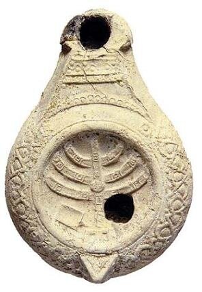 Clay oil lamp decorated with seven-branched menorah, a shoval, and a shofar 4th century CE