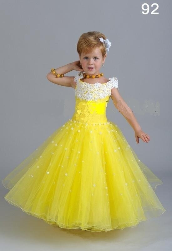 B Нарядное детское платье Фея золотого цвета.