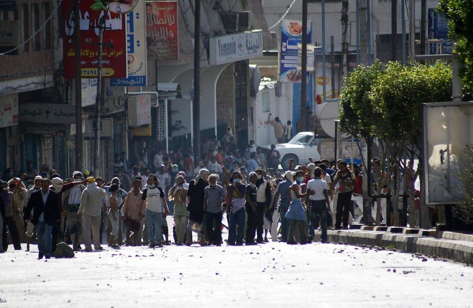 People gather in a street of Taez, south