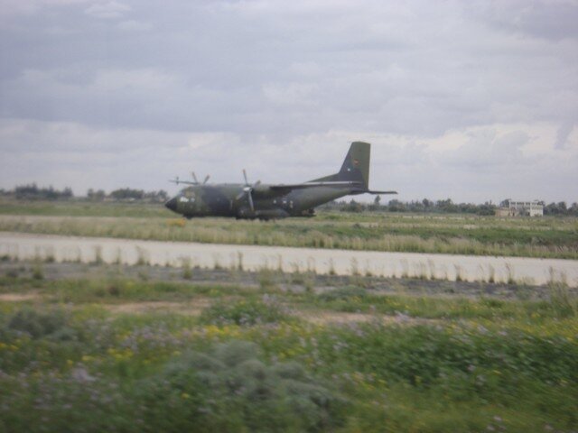 A German Luftwaffe C-160 Transall transport plane is seen at Tripoli airport waiting to evacuate people from Libya