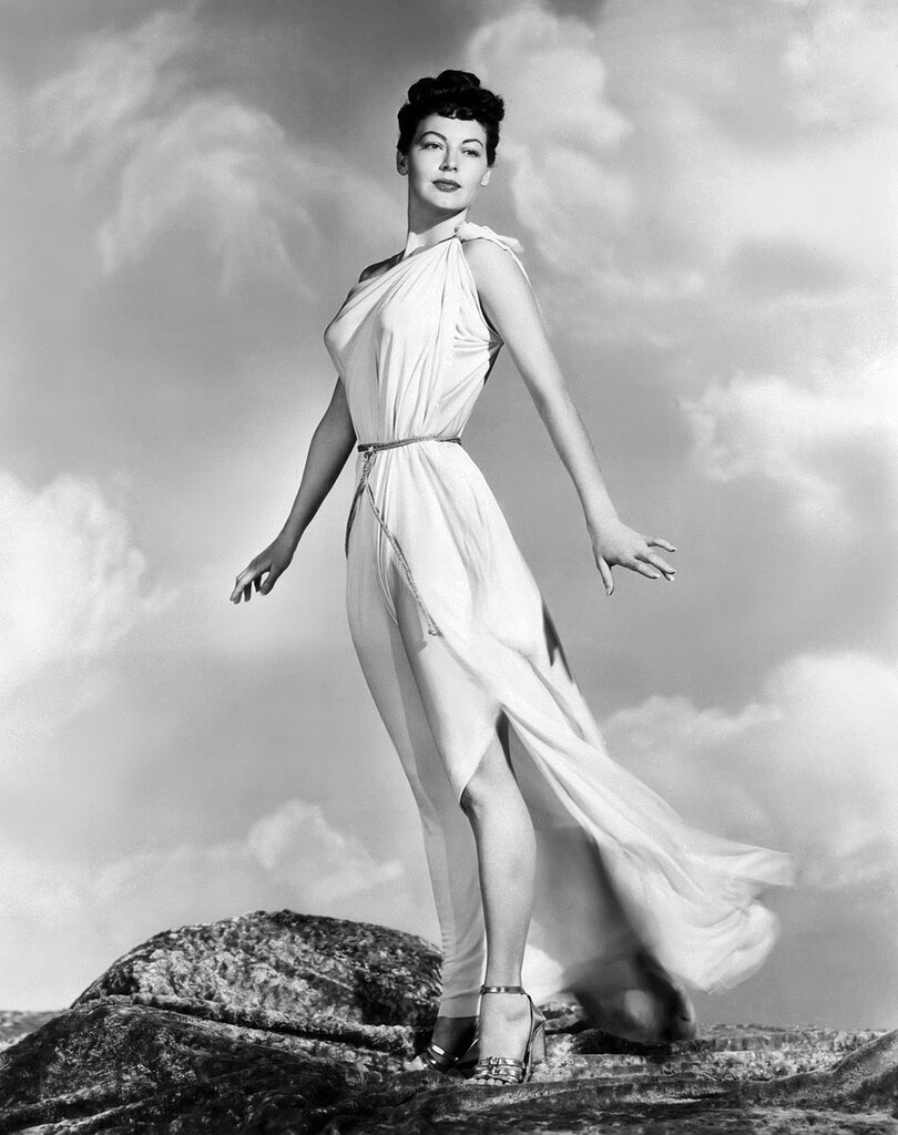 7/20/1948- Hollywood, CA- The breeze toys with the classic Grecian costume of a modern Venus as she stands high on a Hollywood hilltop. Luscious Ava Gardner, who stars in the forthcoming 