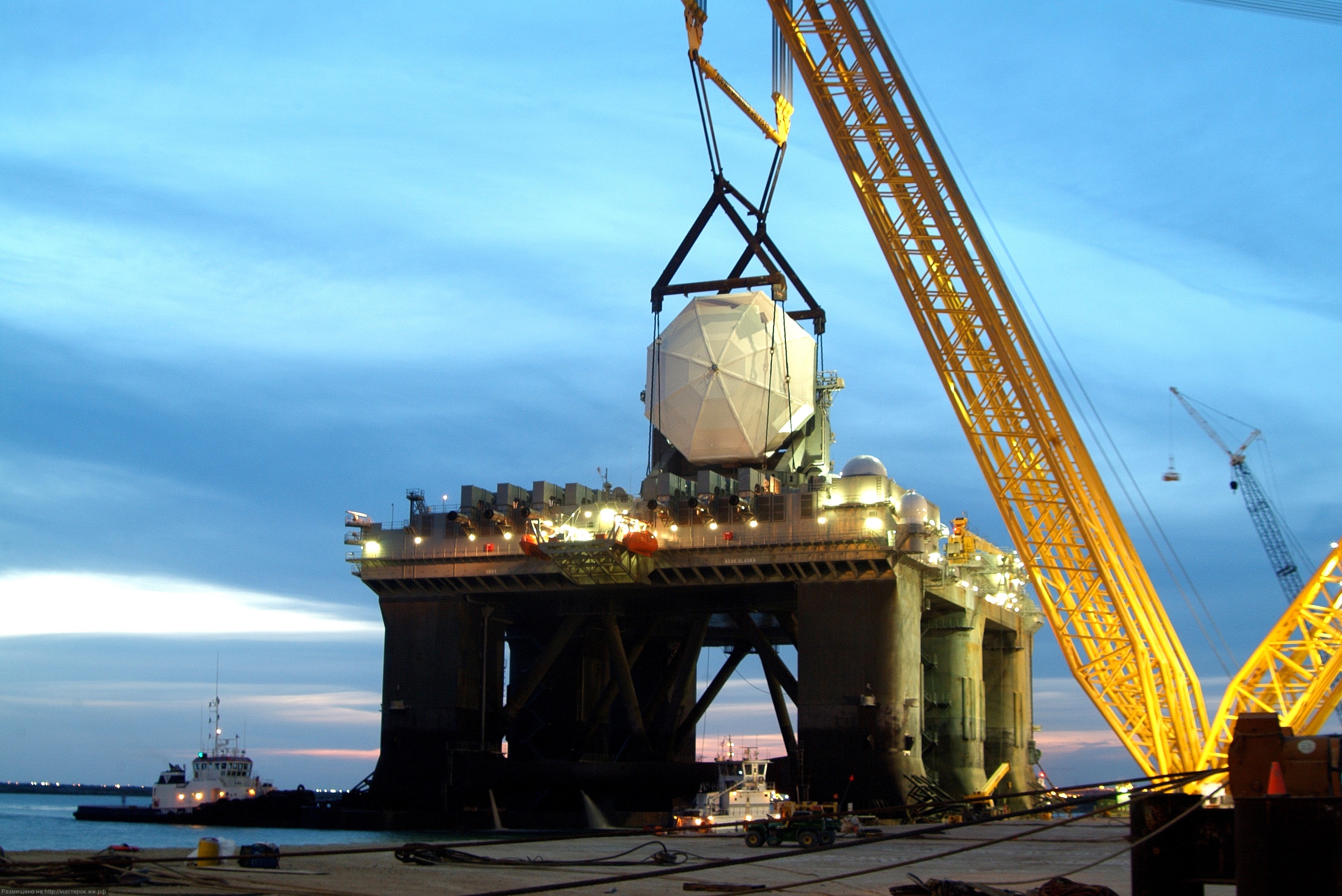 050403-D-0000X-001<br /> A 4-million pound radar assembly is lowered into place aboard a converted offshore oil rig at the Kiewit Offshore Services in Corpus Christi, Texas, on April 3, 2005, for what will become the Sea-Based X-band Radar for the Missile Def