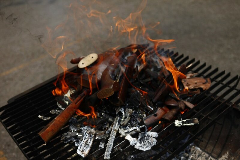Parts of guns confiscated by national security authorities are burnt at a military zone of Mexico City