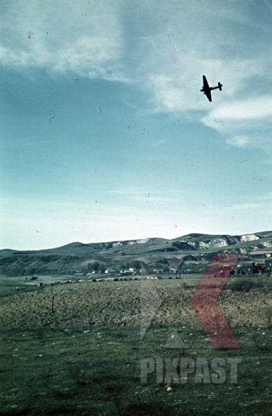 stock-photo-german-luftwaffe-reconnaissance-airplane-flying-over-greek-village-greece-1941-9977.jpg