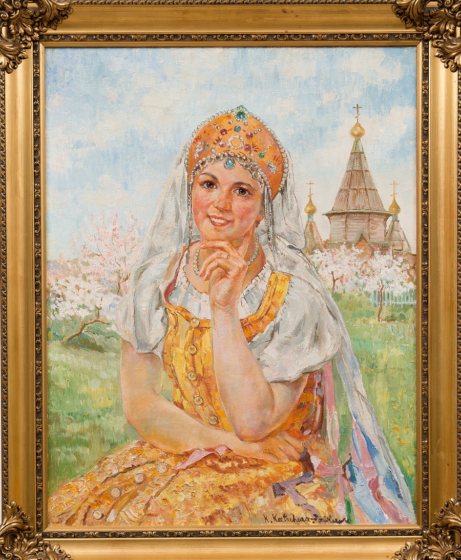 A GIRL IN TRADITIONAL COSTUME WHEN THE APPLE TREES BLOSSOM.