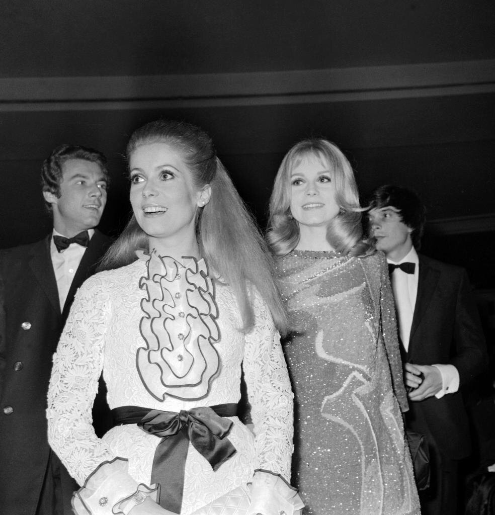 PARIS, FRANCE:  Actresses and sisters Francoise Dorleac (R) and Catherine Deneuve (L) smile at the "premiFre" of Jacques demy musical film "Les demoiselles de Rochefort", Paris, 08 March 1967. Francoise Dorleac died later this year in a road accident, 26
