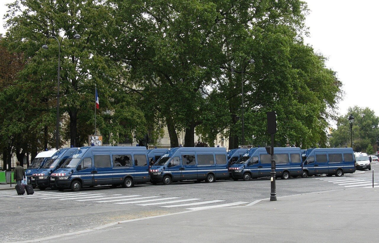 Police buses on the Champs-Elysees, Paris